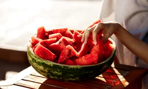 woman s hand taking watermelon copy space jpg