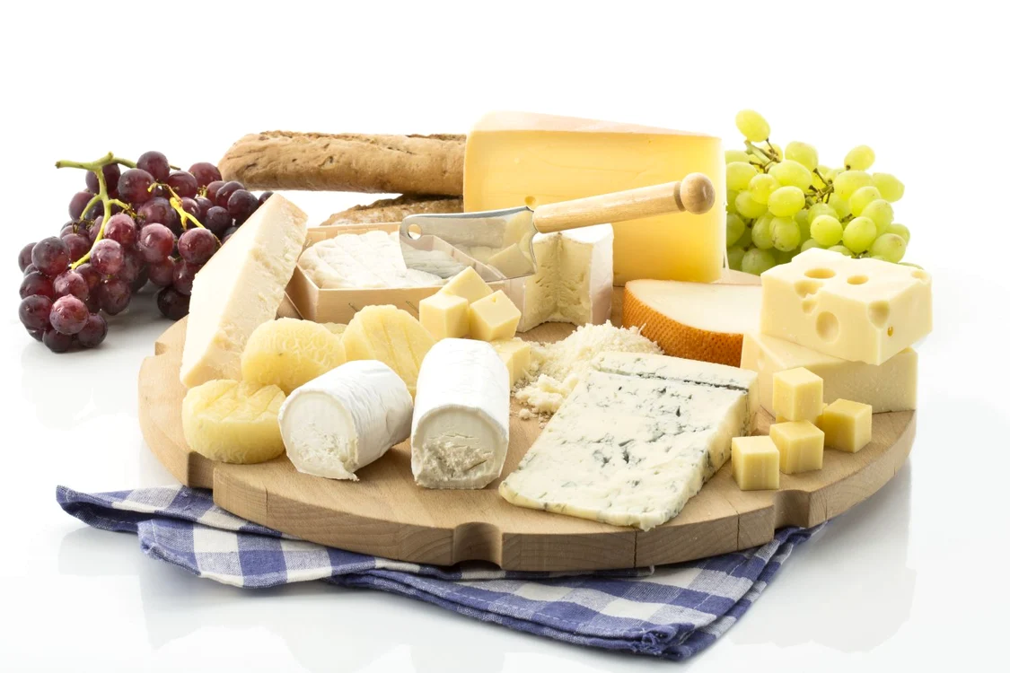 Cheese platter with different cheese and grapes jpeg