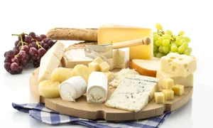 Cheese platter with different cheese and grapes jpeg