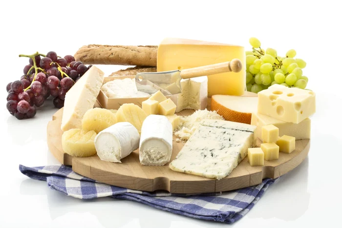 Cheese platter with different cheese and grapes jpeg