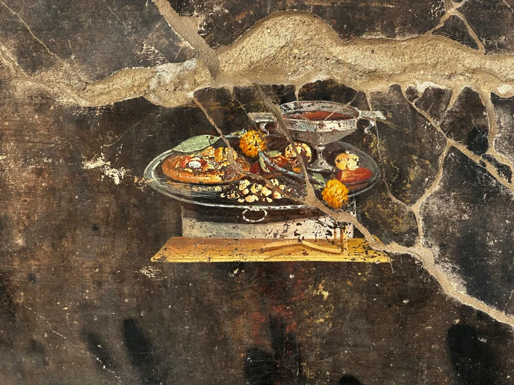 O pictură cu o pizza veche de 2.000 de ani, descoperită în Pompeii / Foto: Twitter