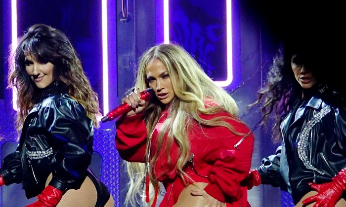 Jennifer Lopez shakes her derriere and swings a stickball stick at a Tidal Concert at Barclays in Brooklyn jpeg