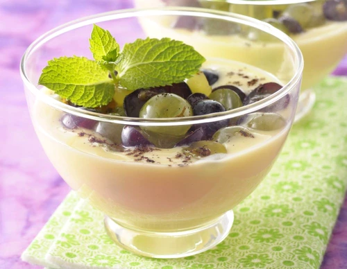 Almond cream dessert with black and white grapes jpeg