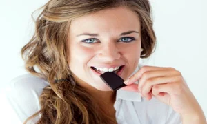 young woman in underwear eating chocolate isolated on white 1301 7694 jpeg