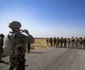  Soldații unui convoi militar rusesc și omologii lor americani s-au salutat în timp ce rutele lor de patrulare s-au intersectat pe un câmp petrolier din Siria FOTO AFP