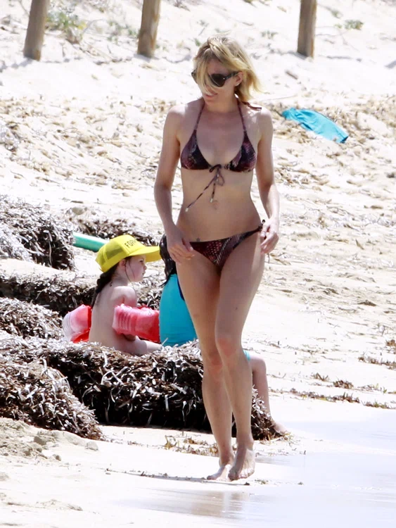 NO CREDITSienna Miller in bikini on holiday in Spain with her family jpeg