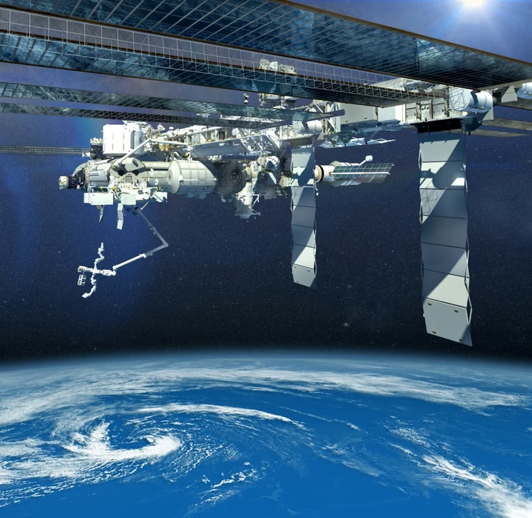 Randare 3D a Staţiei Spaţiale Internaţionale, cu un braţ robotic extins. Imagine cu scop ilustrativ Foto: Shutterstock