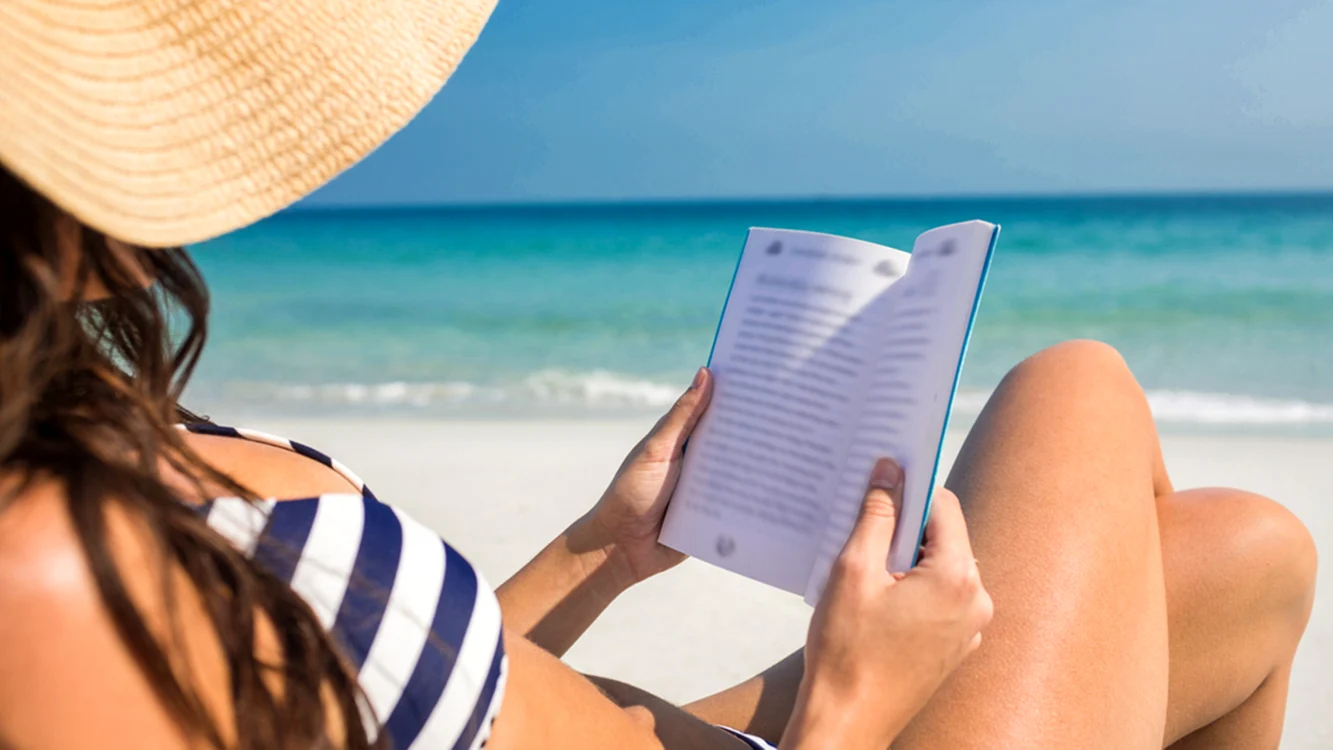 3 reading book on beach jpg jpeg