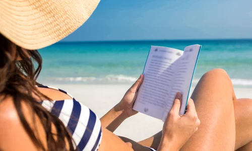 3 reading book on beach jpg jpeg