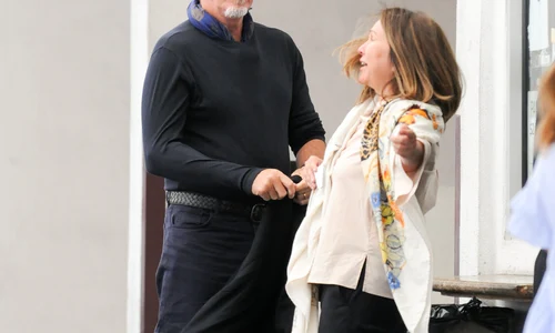 Pierce Brosnan greets fans while parking jpeg