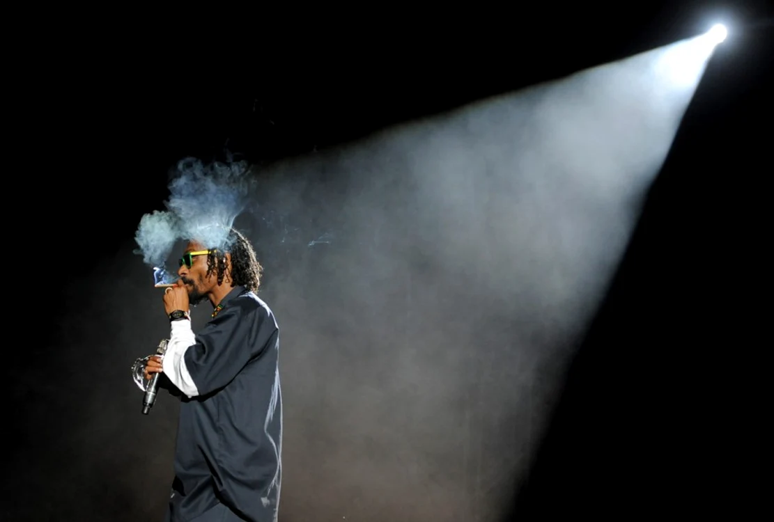 snoop dogg smokes onstage during his headlining performance with dr  dre on the first weekend of coachella 2012 on april 15 2012  ap photochris pizzello 960x648 jpeg