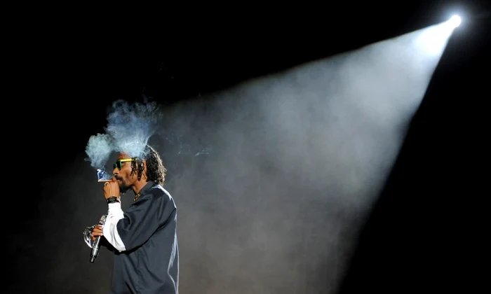 snoop dogg smokes onstage during his headlining performance with dr  dre on the first weekend of coachella 2012 on april 15 2012  ap photochris pizzello 960x648 jpeg