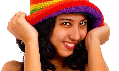 attractive teenager smiling and holding her hat zy6bhvpu jpeg