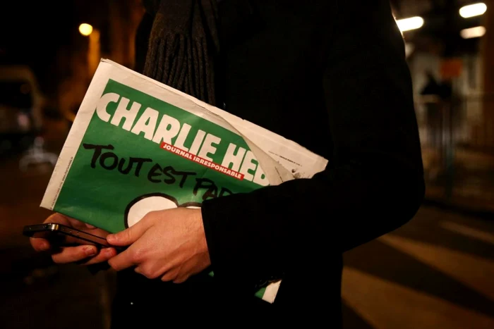 „Tout est pardonné“ („Totul este iertat“), mesaj principal pe coperta săptămalului „Charlie Hebdo”, prima ediţie scoasă pe piaţă după atentatul terorist  FOTO AP