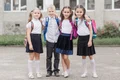 boy hugging girls near school jpg