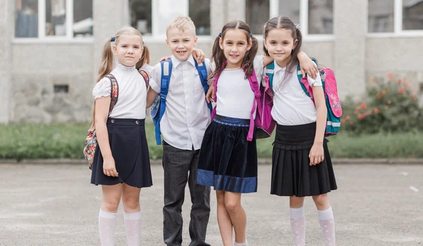 boy hugging girls near school jpg