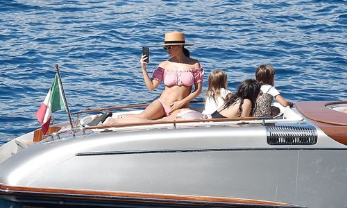*EXCLUSIVE* Kourtney Kardashian has fun with her children aboard a boat in Portofino jpeg