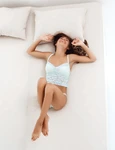 young beautiful woman lying bed early morning shot from jpg
