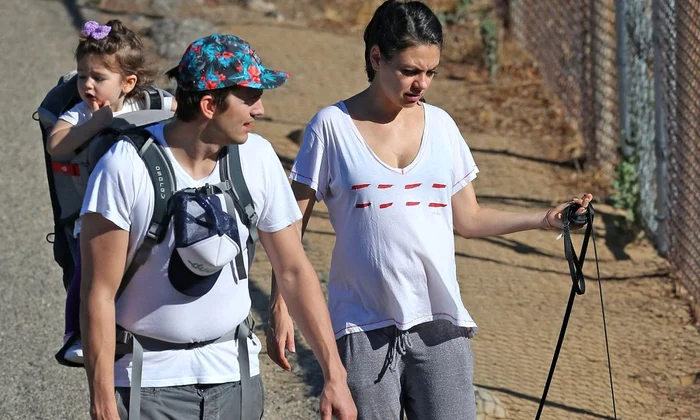 Exclusive Pregnant Mila Kunis, Ashton Kutcher, & Daughter Wyatt Out Walking Their Dogs jpeg