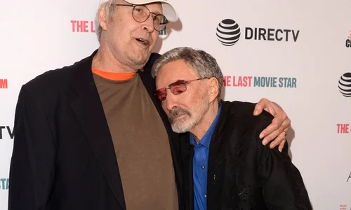 Burt Reynolds and Chevy Chase kiss on the red caroet at the premiere of "The Last Movie Star" jpeg