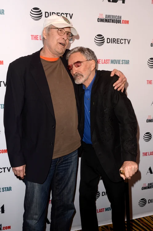 Burt Reynolds and Chevy Chase kiss on the red caroet at the premiere of "The Last Movie Star" jpeg