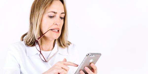 woman with glasses browsing smartphone jpg