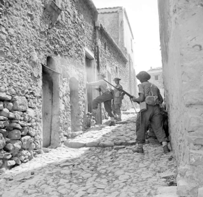 30 men of the 6th inniskillings 38th irish brigade searching houses during mopping up operations in centuripe sicily august 1943  na5388 640x621 jpg jpeg