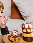 kid eating doughnuts home jpg