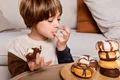 kid eating doughnuts home jpg