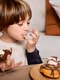 kid eating doughnuts home jpg