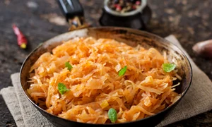 49938440   stewed cabbage on the old wooden background in rustic style jpeg