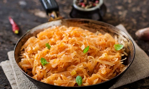 49938440   stewed cabbage on the old wooden background in rustic style jpeg