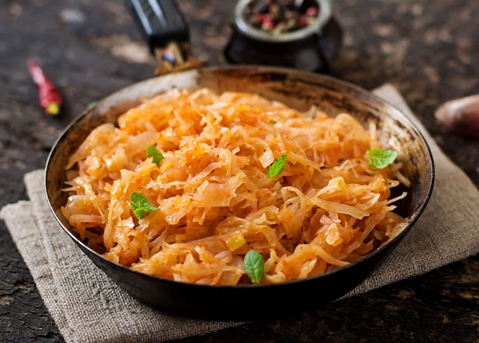 49938440   stewed cabbage on the old wooden background in rustic style jpeg