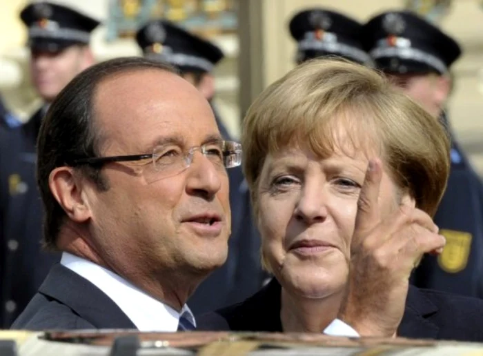 Angela Merkel şi Francois Hollande se întâlnesc la Berlin să sărbătorească o jumătate de secol de relaţii franco-germane FOTO AFP