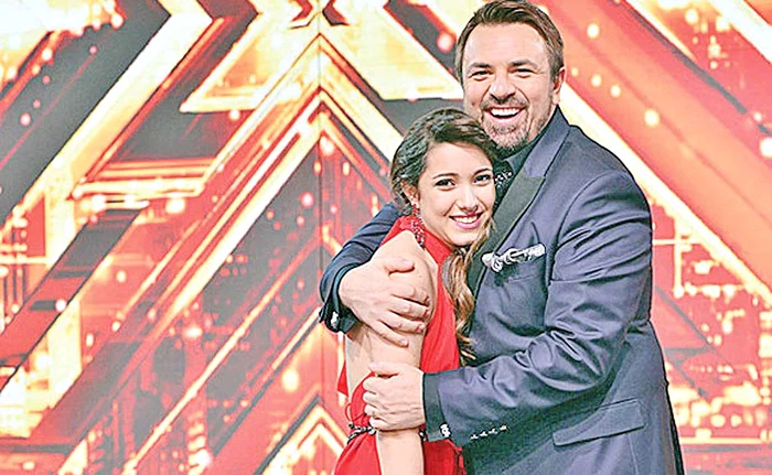 
    Adina a câștigat „X Factor” în 2014, susținută de Brenciu  