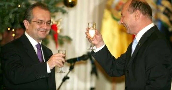 Preşedintele Traian Băsescu şi premierul Emil Boc, după votul Parlamentului