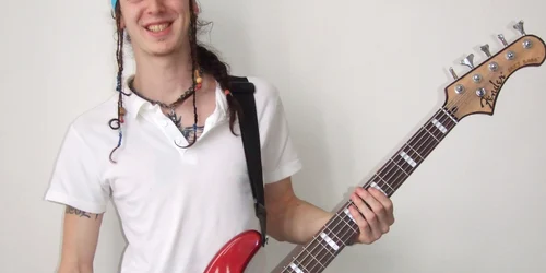 Este basistul trupei sătmărene Crisom şi în acelaşi timp al trupei Stand Alone