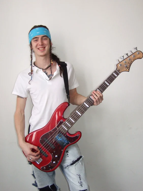 Este basistul trupei sătmărene Crisom şi în acelaşi timp al trupei Stand Alone