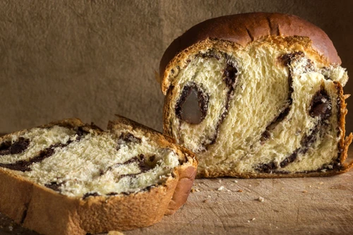 56364523 romanian traditional sponge cake cozonac over wooden background jpeg
