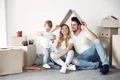 family moving using boxes jpg