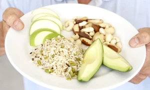 Mid Adult Man Holding Plate Of Healthy Food jpeg
