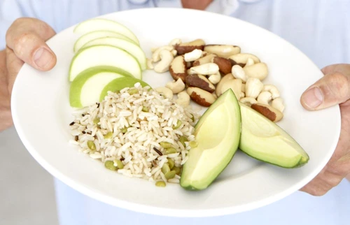 Mid Adult Man Holding Plate Of Healthy Food jpeg