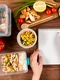 hands writing notebook with casseroles ad food jpg