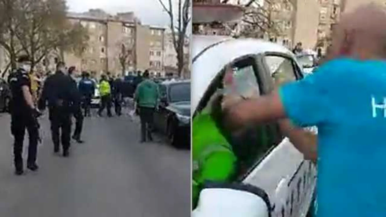 Un bărbat atacă maşina Poliţiei.