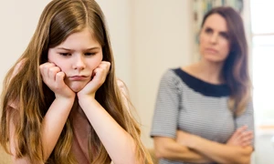 daughter sitting upset with her mother living room jpg