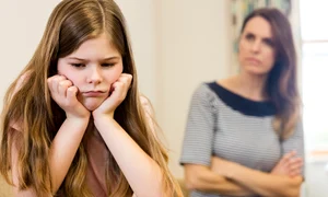 daughter sitting upset with her mother living room jpg