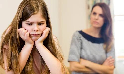 daughter sitting upset with her mother living room jpg