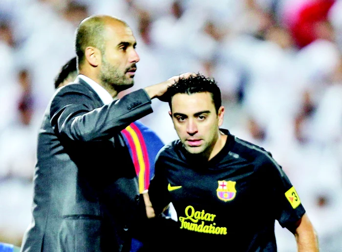 Guardiola (stânga) şi Xavi