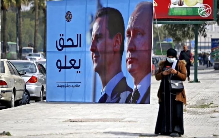 Bashar al-Assad și Putin, pe un panou. FOTO arhivă AFP