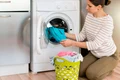 casual woman doing laundry jpg